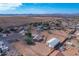 Aerial view of property showing house, detached garage, and ample land at 3936 E Ascot Dr, San Tan Valley, AZ 85140