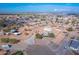 Aerial view of a house with a large yard, detached garage, and surrounding area at 3936 E Ascot Dr, San Tan Valley, AZ 85140