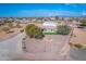 Aerial view of a house with a large yard and detached garage at 3936 E Ascot Dr, San Tan Valley, AZ 85140