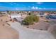 Aerial view of property showing house, detached garage, and large lot at 3936 E Ascot Dr, San Tan Valley, AZ 85140