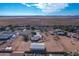 Aerial view of a house, detached garage, and surrounding desert landscape at 3936 E Ascot Dr, San Tan Valley, AZ 85140