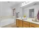 Clean bathroom featuring a bathtub and double vanity at 3936 E Ascot Dr, San Tan Valley, AZ 85140