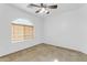 Bright bedroom with ceiling fan and arched window at 3936 E Ascot Dr, San Tan Valley, AZ 85140