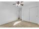 Well-lit bedroom featuring a ceiling fan and double doors leading to the closet at 3936 E Ascot Dr, San Tan Valley, AZ 85140