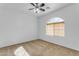 Spacious bedroom with ceiling fan and arched window at 3936 E Ascot Dr, San Tan Valley, AZ 85140