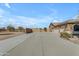 Long driveway leading to a large house and garage at 3936 E Ascot Dr, San Tan Valley, AZ 85140