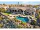 Aerial view of an exquisite home showcasing a luxurious pool, spa, and outdoor entertainment area at 402 E Windmere Dr, Phoenix, AZ 85048