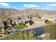 Stunning aerial view of a luxurious home featuring a three-car garage and pristine desert landscaping at 402 E Windmere Dr, Phoenix, AZ 85048