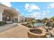 A backyard oasis featuring a pool, landscaping, and a firepit at 402 E Windmere Dr, Phoenix, AZ 85048