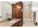 Bathroom featuring tile flooring and bath/shower combination, and a granite countertop at 402 E Windmere Dr, Phoenix, AZ 85048