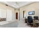 This bedroom features neutral walls, carpet, and a ceiling fan at 402 E Windmere Dr, Phoenix, AZ 85048