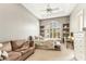 Comfortable bedroom featuring a large window, couch, and desk space, with a neutral color palette at 402 E Windmere Dr, Phoenix, AZ 85048