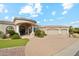 Stunning home showcasing a circular driveway, well-manicured landscaping, and a grand entrance with beautiful columns at 402 E Windmere Dr, Phoenix, AZ 85048