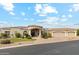 Elegant stucco home featuring a circular driveway, grand entrance with columns, and a three-car garage at 402 E Windmere Dr, Phoenix, AZ 85048