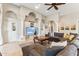 Living room with sectional sofa, stylish arches, and built-in media center for entertainment at 402 E Windmere Dr, Phoenix, AZ 85048