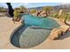 A beautiful pool with a beach entrance and tile sea creatures at 402 E Windmere Dr, Phoenix, AZ 85048