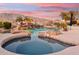 Stunning swimming pool with a rock waterfall and a relaxing hot tub at 402 E Windmere Dr, Phoenix, AZ 85048