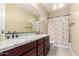 Bathroom with double vanity, granite countertop, and shower/tub combo at 4176 E Glacier Pl, Chandler, AZ 85249