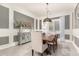 Elegant dining room with a wood table and gray walls at 4176 E Glacier Pl, Chandler, AZ 85249