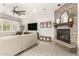 Cozy living room with stone fireplace and comfortable seating at 4176 E Glacier Pl, Chandler, AZ 85249