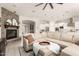 Large living room with sectional sofa and view into the kitchen at 4176 E Glacier Pl, Chandler, AZ 85249