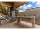 Outdoor kitchen and entertainment area with stone accents at 4176 E Glacier Pl, Chandler, AZ 85249