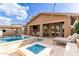 Inviting pool and patio area, complete with a fire pit and outdoor seating at 4176 E Glacier Pl, Chandler, AZ 85249