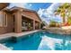 Luxury pool and patio with covered seating; perfect for relaxation at 4176 E Glacier Pl, Chandler, AZ 85249