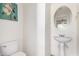 Small bathroom with pedestal sink and white toilet at 4322 E Whitehall Dr, San Tan Valley, AZ 85140