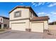 Two-story house showcasing a side view of its two-car garage at 4322 E Whitehall Dr, San Tan Valley, AZ 85140