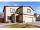 Two-story house with a two-car garage and desert landscaping at 4322 E Whitehall Dr, San Tan Valley, AZ 85140