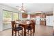 Kitchen with wooden cabinets, a dining table, and tile floors at 4322 E Whitehall Dr, San Tan Valley, AZ 85140