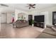 Living room with two sofas, a large TV, and tile floors at 4322 E Whitehall Dr, San Tan Valley, AZ 85140