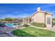 Landscaped backyard with pool, patio, and lush greenery at 4329 E Swilling Rd, Phoenix, AZ 85050