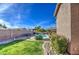 Spacious backyard featuring a sparkling pool and lawn at 4329 E Swilling Rd, Phoenix, AZ 85050