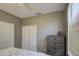 Bedroom with double door closet and dresser at 4329 E Swilling Rd, Phoenix, AZ 85050