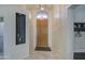 Inviting entryway with wood door and tiled floor at 4329 E Swilling Rd, Phoenix, AZ 85050