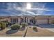 Single-story home with desert landscaping and two-car garage at 4329 E Swilling Rd, Phoenix, AZ 85050