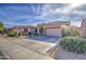 Single-story home with desert landscaping and two-car garage at 4329 E Swilling Rd, Phoenix, AZ 85050