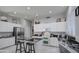 Modern kitchen with white cabinets and granite counters at 4329 E Swilling Rd, Phoenix, AZ 85050