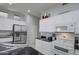 Modern kitchen with white cabinets and granite counters at 4329 E Swilling Rd, Phoenix, AZ 85050