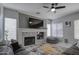 Living room with fireplace and large TV at 4329 E Swilling Rd, Phoenix, AZ 85050