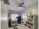 Home office with ceiling fan and built-in shelving at 4329 E Swilling Rd, Phoenix, AZ 85050