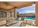 Covered patio with seating area overlooking the pool at 4329 E Swilling Rd, Phoenix, AZ 85050