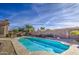 Enjoy this beautiful kidney shaped pool with plenty of space for relaxing and entertaining at 4329 E Swilling Rd, Phoenix, AZ 85050