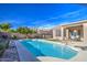 Inviting kidney-shaped pool with surrounding patio at 4329 E Swilling Rd, Phoenix, AZ 85050