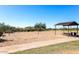 Outdoor sand volleyball court with covered seating at 4329 E Swilling Rd, Phoenix, AZ 85050