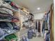 Large walk-in closet with ample shelving and hanging space at 4329 E Swilling Rd, Phoenix, AZ 85050