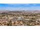 An aerial view showcases homes and local businesses, set against a mountainous backdrop, displaying the community's charm at 4542 W Villa Theresa Dr, Glendale, AZ 85308