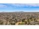 Extensive aerial view showing the residential area and golf course with trees enhancing the neighborhood's appeal at 4542 W Villa Theresa Dr, Glendale, AZ 85308